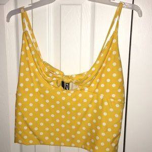 white and yellow polka dot shirt.